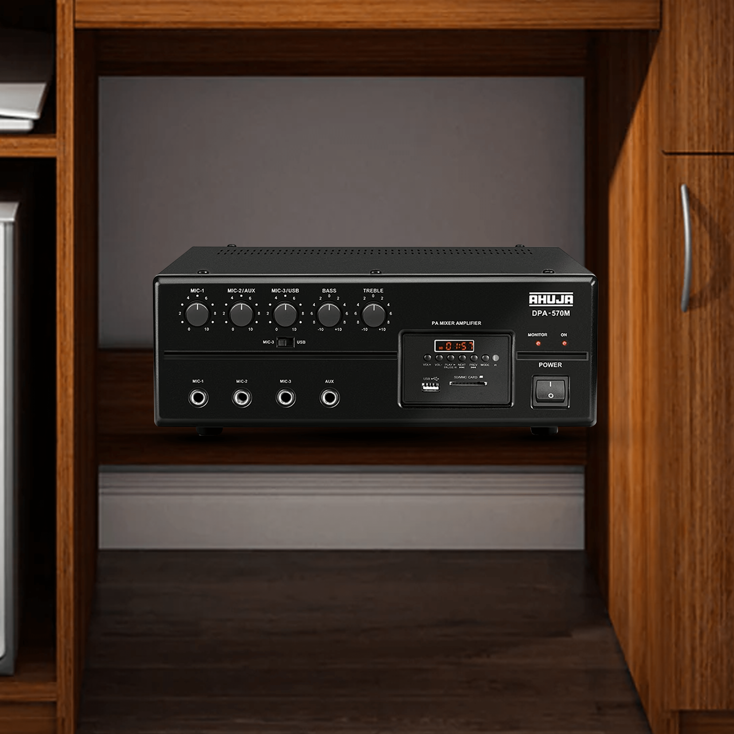 Ahuja DPA-570 Mixer Amplifier in use at a live event with multiple microphones